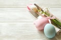 Easter laying table appointments, table setting options. Silverware, tableware items with festive decoration. Fork, knife and flow Royalty Free Stock Photo