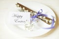 Easter laying table appointments, table setting options. Silverware, tableware items with festive decoration. Fork, knife and flow Royalty Free Stock Photo