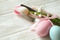 Easter laying table appointments, table setting options. Silverware, tableware items with festive decoration. Fork, knife and flow Royalty Free Stock Photo