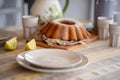 Easter lemon bundt cake, Babka sprinkled with powdered sugar on a festive table decorated Royalty Free Stock Photo