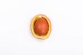 Easter light brown egg in orange peel Royalty Free Stock Photo