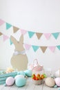 Easter! Many colorful Easter eggs with bunnies and baskets! Easter decoration of the room, children`s room for games. Basket with