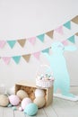 Easter! Many colorful Easter eggs with bunnies and baskets! Easter decoration of the room, children`s room for games. Basket with