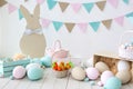Easter! Many colorful Easter eggs with bunnies and baskets! Easter decoration of the room, children`s room for games. Basket with Royalty Free Stock Photo