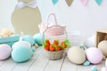 Easter! Many colorful Easter eggs with bunnies and baskets! Easter decoration of the room, children`s room for games. Basket with