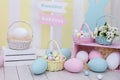 Easter! Many colorful Easter eggs with bunnies and baskets of flowers! Easter room decoration and decor, children playroom. large Royalty Free Stock Photo