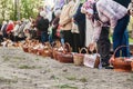 At Easter many people standing in a row with baskets and candles, waiting for the priest to bless. Ukraina.Fastov. May 1, 2016