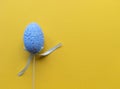 Easter minimalistic banner with copy space. Flat lay with copy space. Single blue egg yellow background. Stock photo Royalty Free Stock Photo
