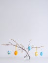 Easter minimalistic decor in the interior. A gray felt basket in the shape of a hare and a large ceramic egg with ears