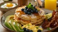 Easter Morning Delights Pancakes, Scrambled Eggs, Avocado, and Bacon Royalty Free Stock Photo