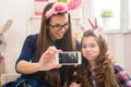 Easter - Mother and daughter with bunny ears, made Selfie photo