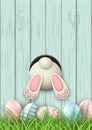 Easter motive, bunny bottom and easter eggs in fresh grass on blue wooden background, illustration