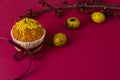 Easter muffin decorated with ribbon and sprinkles, colored eggs and a branch of apricot tree Royalty Free Stock Photo