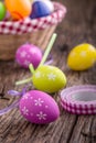 Easter. Multicolored easter eggs in a basket on a wooden table