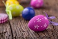 Easter. Multicolored easter eggs in a basket on a wooden table