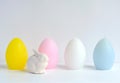Easter Ostara, Eoster bunny with egg shaped candles Royalty Free Stock Photo