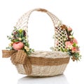 Easter oval basket on white background. Decorated with flowers in pink and greenery. Decorated with sacking Royalty Free Stock Photo