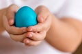 Easter. Painted egg in the hands of a child