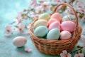 Easter painted eggs in a basket on a blue background with spring flowers. Easter background. Royalty Free Stock Photo
