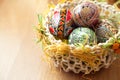 Easter painted eggs in traditional basket Royalty Free Stock Photo