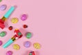 Easter party egg ornaments, blowouts and ladybugs on pink background