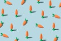 Easter pattern made with carrots on blue background. Creative minimal holiday concept. Flat lay, top view