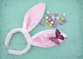 Easter pink bunny ears on aqua blue wood