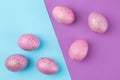 Easter. Pink Easter eggs on trendy lilac and blue background.  Happy easter. holidays. top view Royalty Free Stock Photo