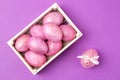 Easter. Pink Easter eggs in a box on a trendy lilac background. Happy easter. holidays. top view Royalty Free Stock Photo