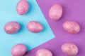 Easter. Pink Easter eggs on trendy lilac and blue background. Happy easter. holidays. top view Royalty Free Stock Photo