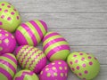 Easter pink and green eggs lying on wooden desk