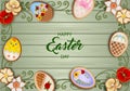 Easter poster with gingerbread eggs and flowers on wooden background
