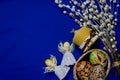 Easter Pussy-willow and Easter egg on blue background. Happy Easter card. with Happy Easter Royalty Free Stock Photo