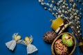 Easter Pussy-willow and Easter egg on blue background. Happy Easter card. with Happy Easter Royalty Free Stock Photo