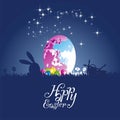 Easter rabbit moon colored egg blue background Royalty Free Stock Photo