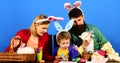 Easter Rabbits family in bunny ears. Mother, father and son preparing for Easter. Royalty Free Stock Photo