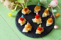 Easter recipe, festive appetizer. Canapes with pineapple, grill chicken, marinated peppers - on the festive table