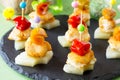 Easter recipe, festive appetizer. Canapes with pineapple, grill chicken, marinated peppers - on the festive table