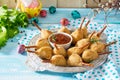 Easter recipe, festive appetizer. Meat in biscuits, deep fried served with ketchup sauce Royalty Free Stock Photo
