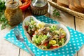 Easter recipe, festive snack. Salad with Pekinese cabbage, herring, sweet pepper and onions - on the festive table