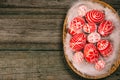 Easter red eggs with folk white pattern lay on feather into basket in the right side of rustic wood table. Ukrainian traditional e Royalty Free Stock Photo