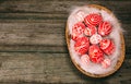 Easter red eggs with folk white pattern lay on feather into basket in the right side of rustic wood table. Ukrainian traditional e Royalty Free Stock Photo