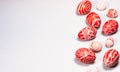 Easter red eggs with folk white pattern scattered white background from right side. Ukrainian traditional eggs Royalty Free Stock Photo