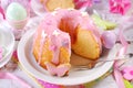 easter ring cake with pink icing and butterfly shaped sugar sprinkles