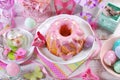 easter ring cake with pink icing and butterfly shaped sugar sprinkles Royalty Free Stock Photo