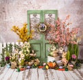 Easter Romantic decorations with greenery and pink and yellow flowers,cute rabbits and textile carrots