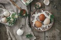 Easter rustic still life. Natural easter eggs, blooming spring flowers, burlap and spoon  flat lay on rural wooden table. Simple Royalty Free Stock Photo