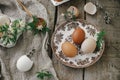 Easter rustic still life. Natural easter eggs, blooming spring flowers, burlap and spoon on rural wooden table. Happy Easter! Royalty Free Stock Photo
