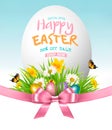 Easter Sale Background. Colofrul eggs in green grass and flowers