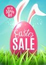 Easter sale banner with egg, easter bunny ears, discount sticker up to 50 off